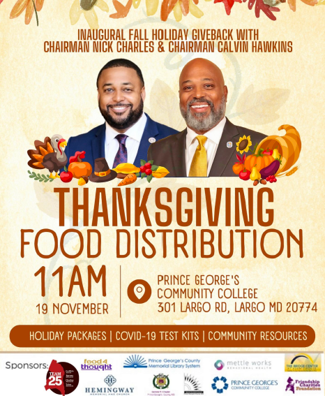 Chairmen Nick Charles and Calvin Hawkins in suits surrounded by Thanksgiving decorations.