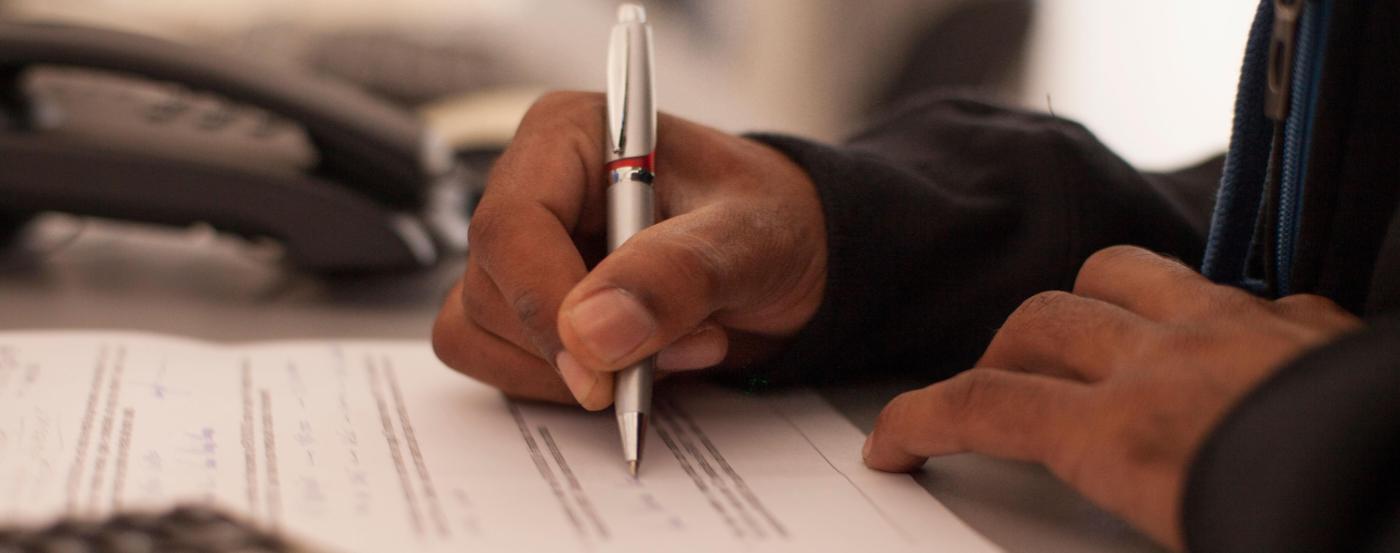 Close up Shot of the Hand of a Student Taking a Test