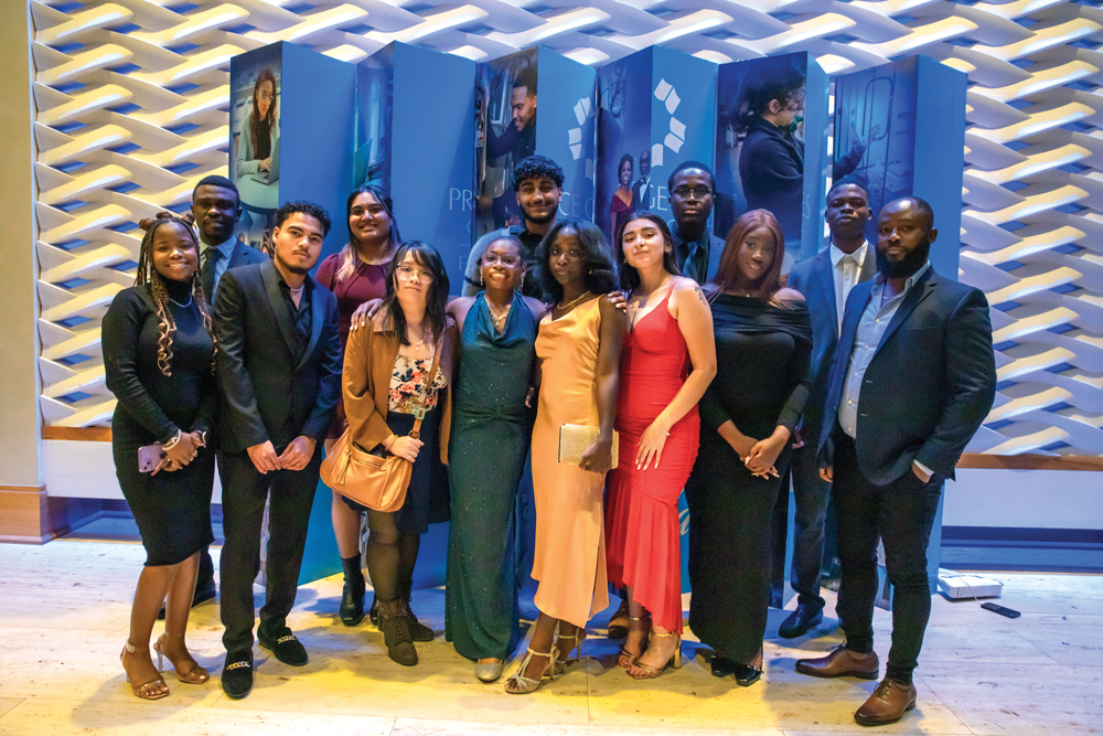 Group of formally dressed students posing together at a gala event.