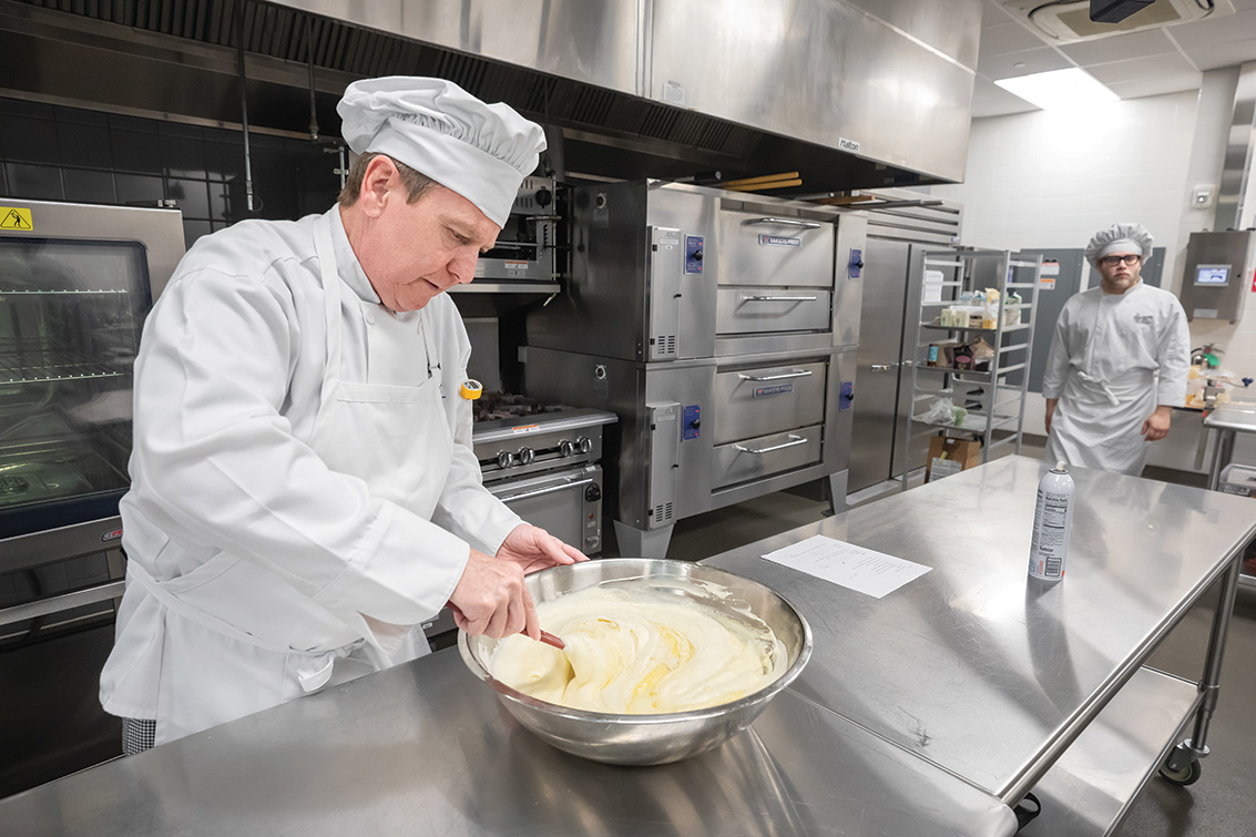 Cameron Foushee, PGCC Culinary Student, cooking in the kitchen