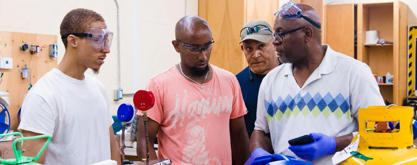 Students and instructor wearing goggles in a classroom at Westphalia Training Ce