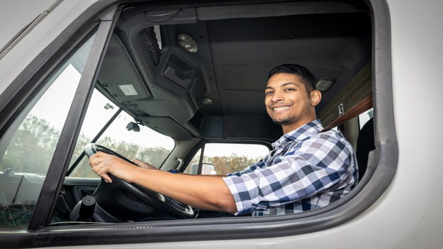 CDL student inside the commercial truck driving