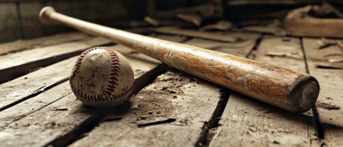 Old Baseball and baseball bat on wooden slats